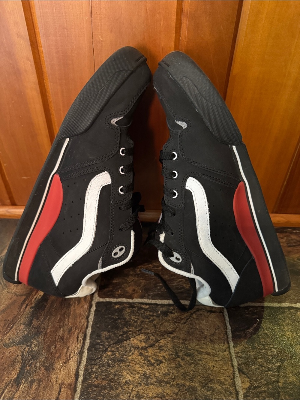 Vans mens Black and White Rowley Skate Sneakers with Red Heel Accent